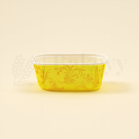 Yellow decorative container with floral patterns on a beige background
