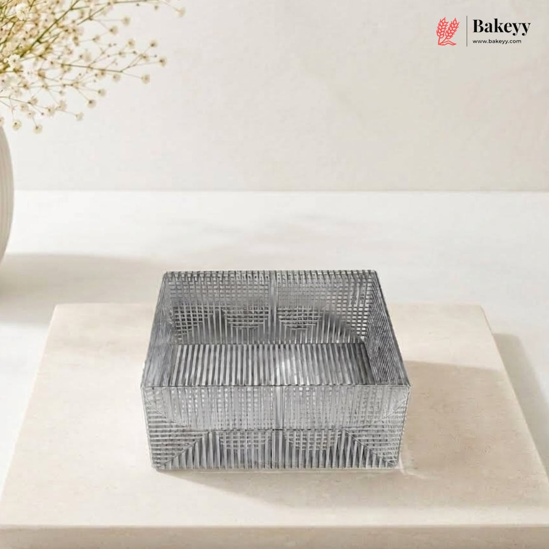 Metal wire basket on a white surface with 'Bakeyy' branding in the corner.