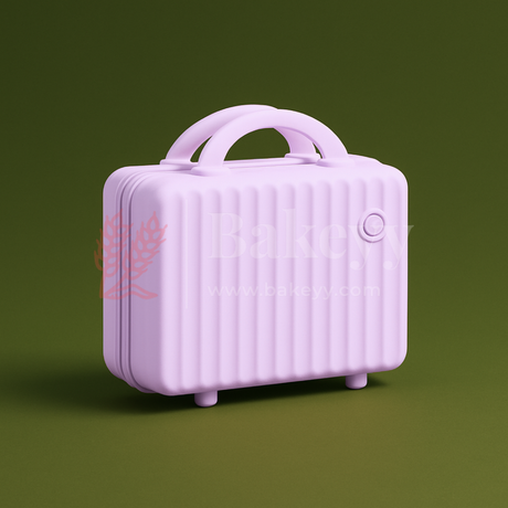 Small purple suitcase on a green background