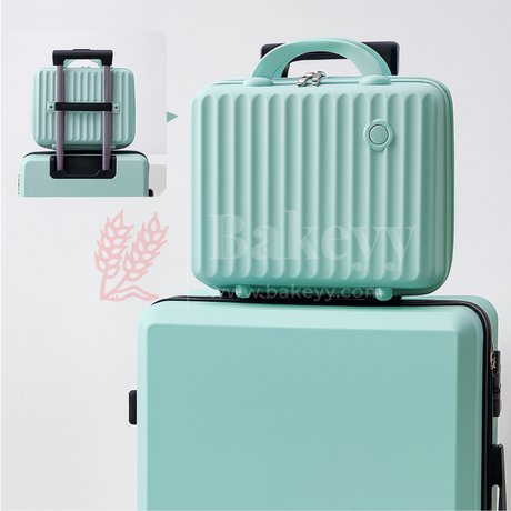 Mint green suitcase with a smaller matching travel case on top, featuring the brand 'bakeyy'.