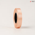 Roll of pink ribbon on a light beige background with 'Bakeyy' branding.