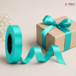 Turquoise ribbon spool and wrapped gift box with a bow on a beige background, featuring the Bakey brand.