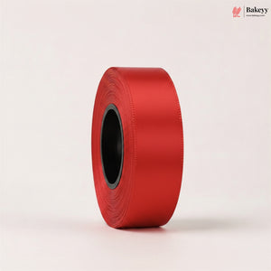 Roll of red ribbon on a light beige background with 'Bakeyy' branding.