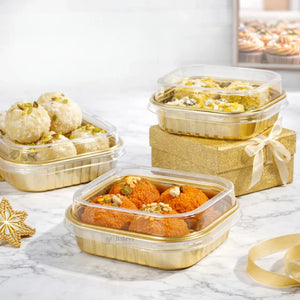 Bakeyy gold mini muffin pastry packaging boxes filled with assorted sweets on marble table