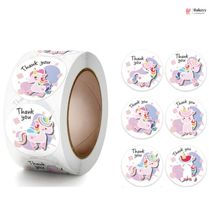 Roll of unicorn-themed 'Thank you' stickers with a visible brand logo.