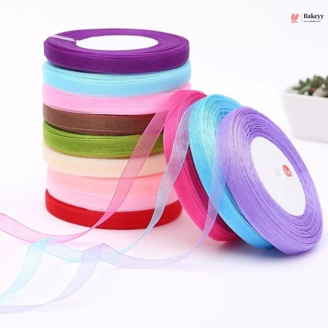 Colorful ribbons in spools on a white background