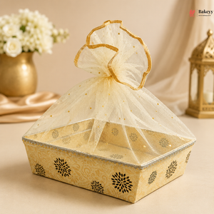 Decorative box with a sheer lid featuring a bow, on a beige background.