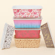 Set of colorful storage bins with various patterns on a beige background