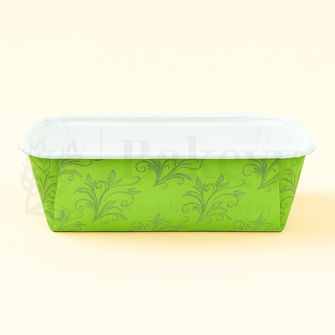 Green floral-patterned container with a white lid on a light yellow background