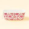 Rectangular container with pink heart pattern on a light yellow background