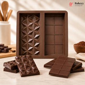 Chocolate mold with geometric patterns on a wooden surface, featuring the Bakey brand.