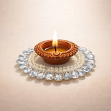 Decorative clay diya with pearls and crystals, festive décor from Bakeyy wholesale baking supplies.