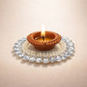 Decorative clay diya with pearls and crystals, festive décor from Bakeyy wholesale baking supplies.
