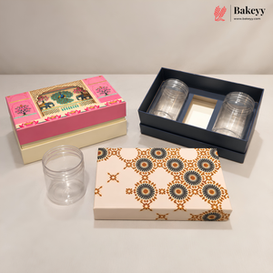 A set of clear plastic storage jars and decorative gift boxes on a light gray surface. The set includes two patterned cream and orange boxes, one pink and cream box, and a dark navy box containing two clear jars.
