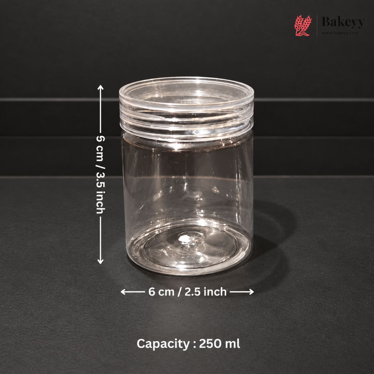 A clear plastic jar with a screw-top lid, shown on a dark background with overlaid dimensions: 6 cm / 2.5 inch in diameter and 5 cm / 3.