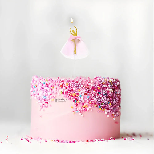 Pink sprinkle cake with ballerina candle topper from Bakeyy, wholesale baking supplies India