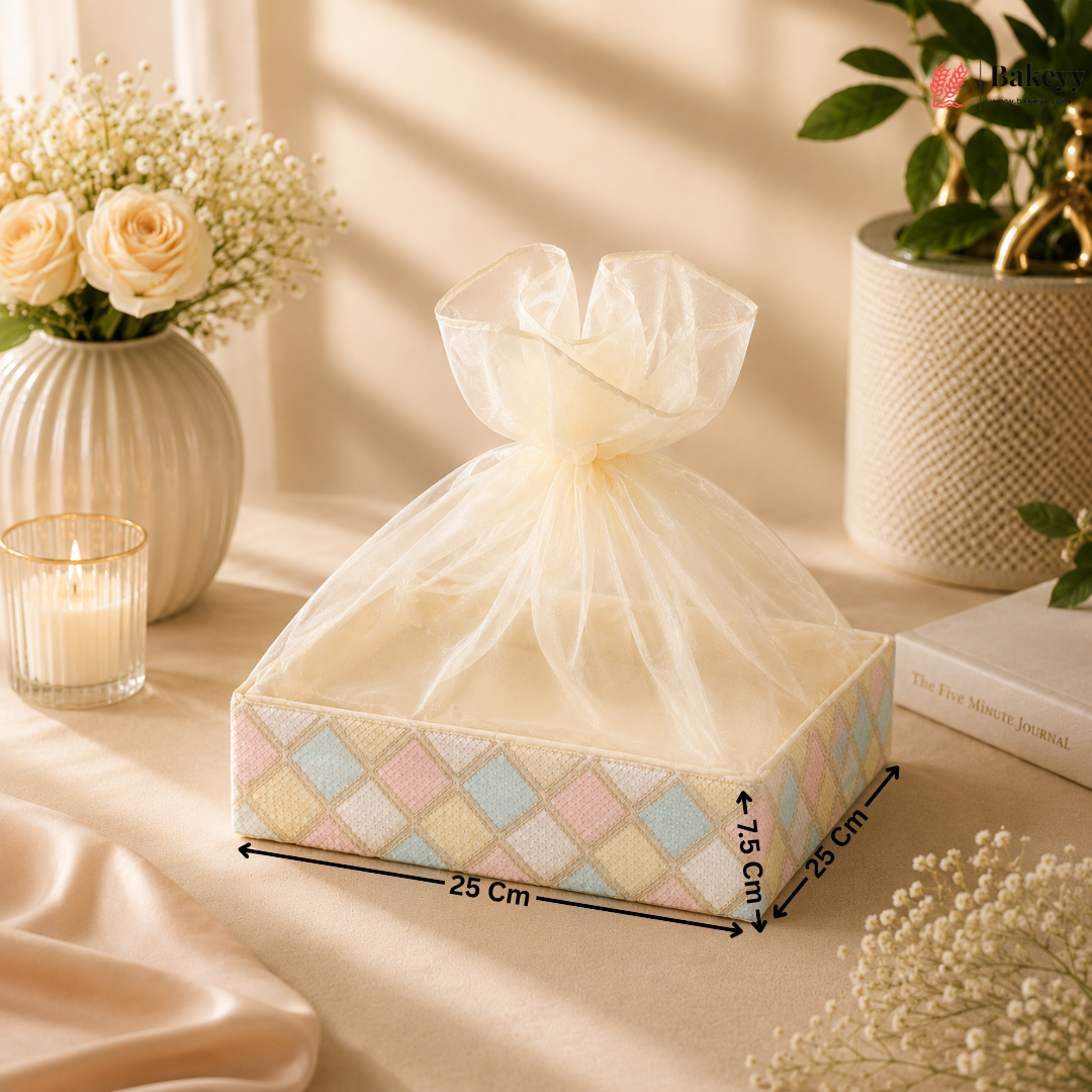 Decorative box with a bow on a table with flowers and candles