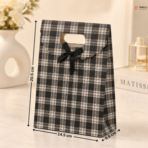Black and white checkered gift bag with a bow, shown with measurements on a light background.