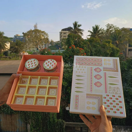 Premium rigid box with festive decorative lid for an upscale look
Gold cavity tray insert for neat, secure sweet/chocolate placement
Dual-compartment layout: sweets tray section + 2-jar space
Strong structure to help protect items during handling &amp; transport
Ideal for gifting: weddings, festivals, corporate gifting, return gifts, hampers
Reusable as premium storage or keepsake packaging