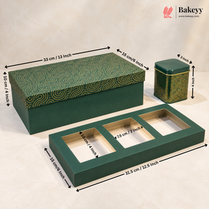 Three green bakery gift boxes with printed gold wave patterns and black dimension arrows and labels showing measurements on a light beige fabric background. The Bakeyy logo is visible in the top right corner.