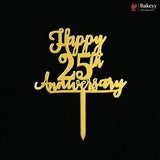 Gold metal cake topper with 'Happy 25th Anniversary' script on a black background, featuring a Bakeyy logo in the top right corner.