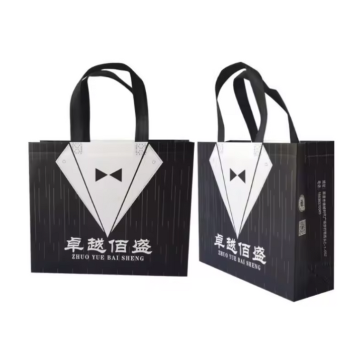 PVC Lamination Bags, Black Batman bag with black handles, Non Woven Design, 4 sizes available - Bakeyy.com