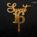 Gold metallic cake topper spelling 'Sweet 16' on a black background, with a small Bakeey logo in the top right corner.