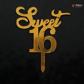Gold metallic cake topper spelling 'Sweet 16' on a black background, with a small Bakeey logo in the top right corner.