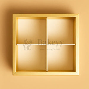 Gold rectangular box with a divided interior on a beige background, featuring the brand 'Bakeryy'.