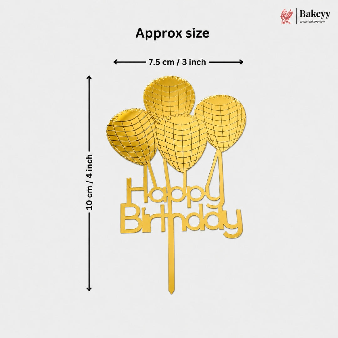 Gold-colored 'Happy Birthday' cake topper with balloon graphics, showing approximate dimensions of 10 cm in height and 7.5 cm in width, with a Bakeyy logo in the top right corner.