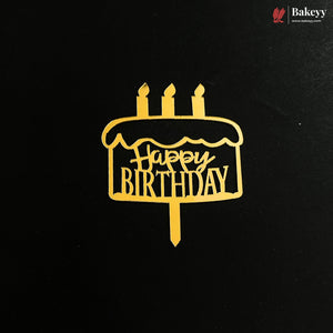 A gold metal cake topper with 'Happy Birthday' written on it, displayed on a black background with a Bakeey brand logo in the top right corner.