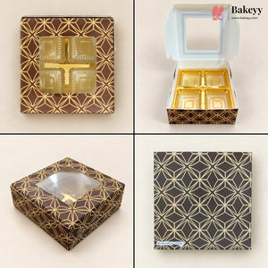 Four-panel product display of a square bakery box with a clear window and geometric gold foil pattern on a dark brown background. The panels show the closed box from multiple angles, an open box with four gold-tray compartments, and a flat pattern close-up.