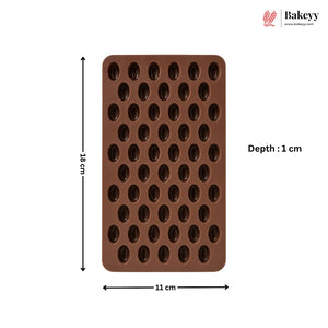 A brown silicone mold with oval cavities, shown with dimension labels indicating 18 cm height, 11 cm width, and 1 cm depth, on a white background with the Bakeey logo in the top right.