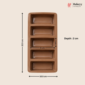 A brown rectangular silicone mold with four deep loaf cavities, shown with dimension annotations: 22.5 cm height, 10.