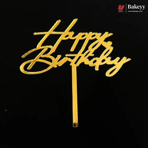 Gold metallic 'Happy Birthday' script cake topper on a black background, with a Bakeey brand logo in the top right corner.