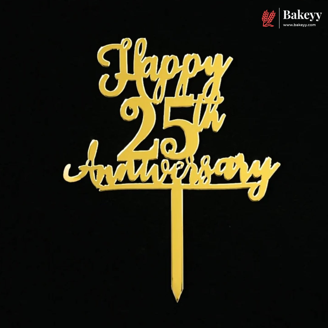 Gold acrylic 25th birthday cake topper with 'Happy 25th Anniversary' script on a black background, featuring a Bakeyy logo in the top right corner.
