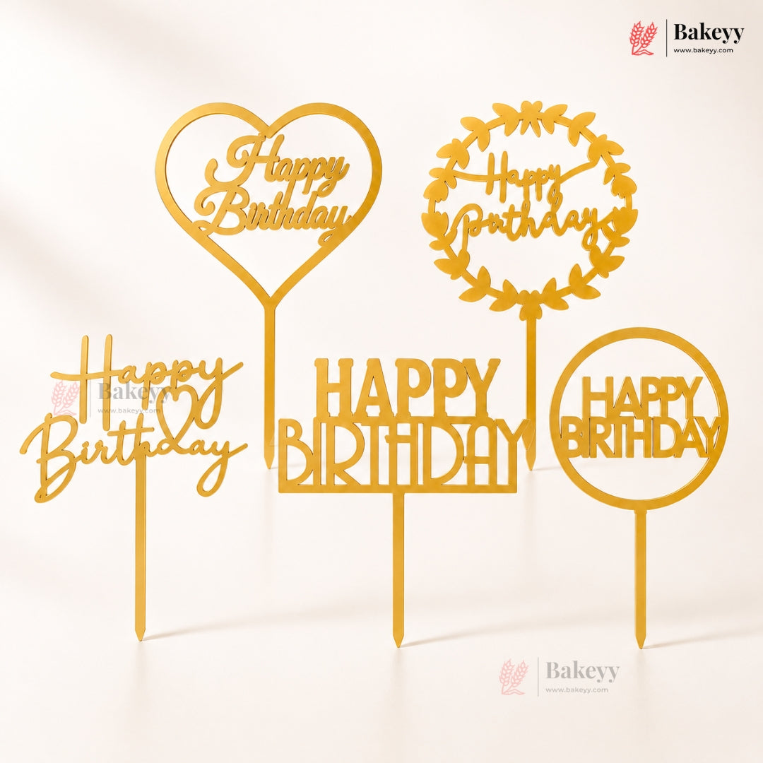 Gold 'Happy Birthday' cake toppers with different designs on a white background, featuring the Bakeyy brand.