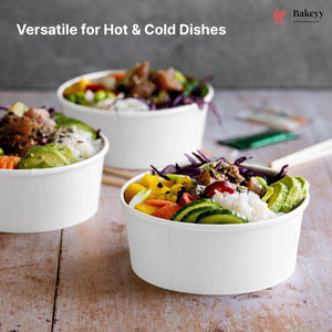 White bowls filled with colorful food on a wooden surface, with 'Bakeyy' branding.