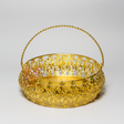 Gold decorative basket with intricate patterns on a light gray background
