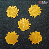 Five round golden-yellow embossed flower-shaped baking stamps or molds arranged on a dark textured background, with a central stamp showing a vertical measurement marker of 6 cm / 2 inches. The Bakeey brand logo is visible in the top right corner.