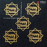 Five gold-colored laser-cut Diwali decorations with 'Happy Diwali' text inside geometric diamond frames, displayed on a dark textured background with dimension arrows indicating 6 cm by 2.3 inch measurements.
