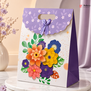 Decorative gift bag with colorful floral design on a neutral background