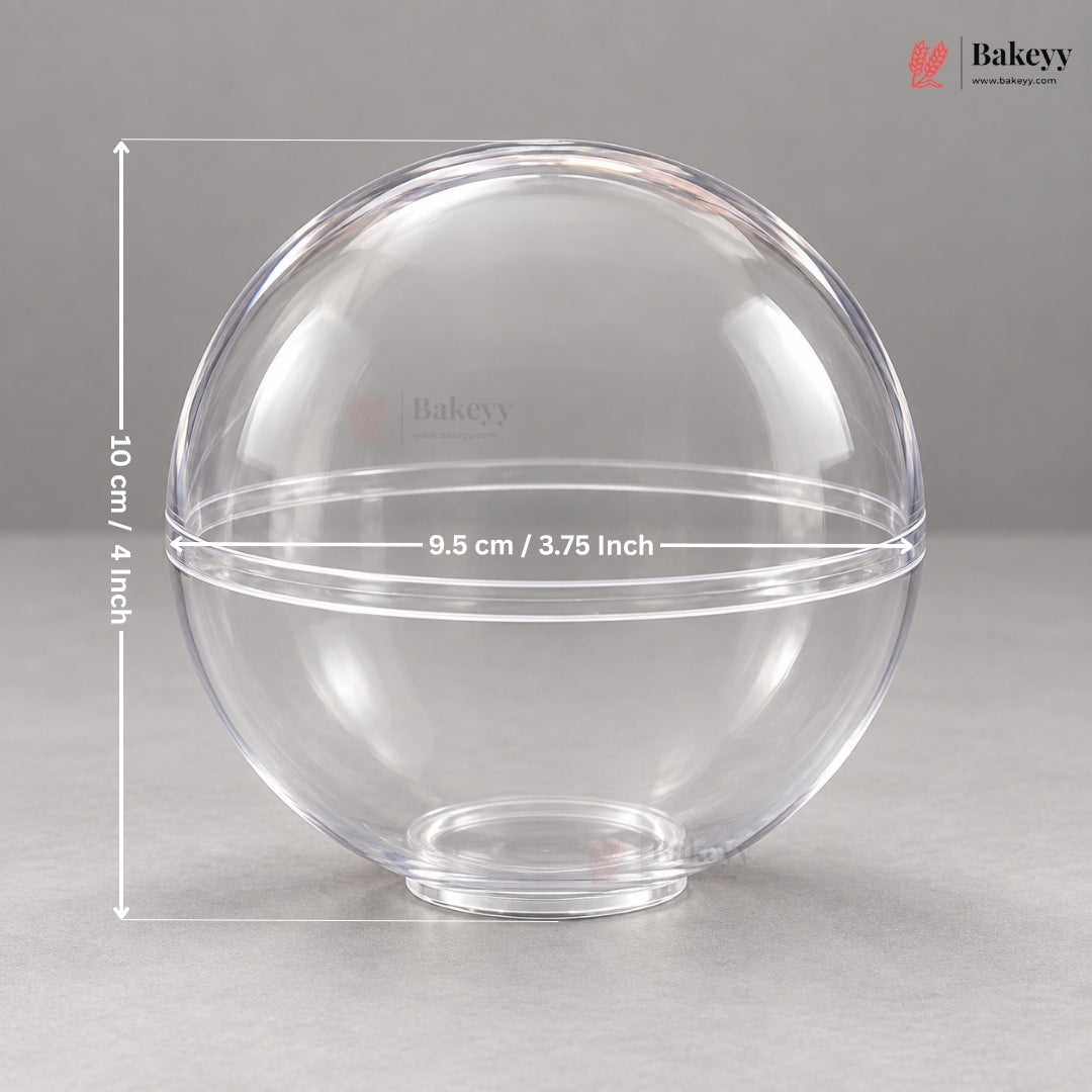 A clear round plastic container or lid shown on a gray studio background with overlaid dimension lines and text indicating a height of 10 cm / 4 inches and a diameter of 9.5 cm / 3.