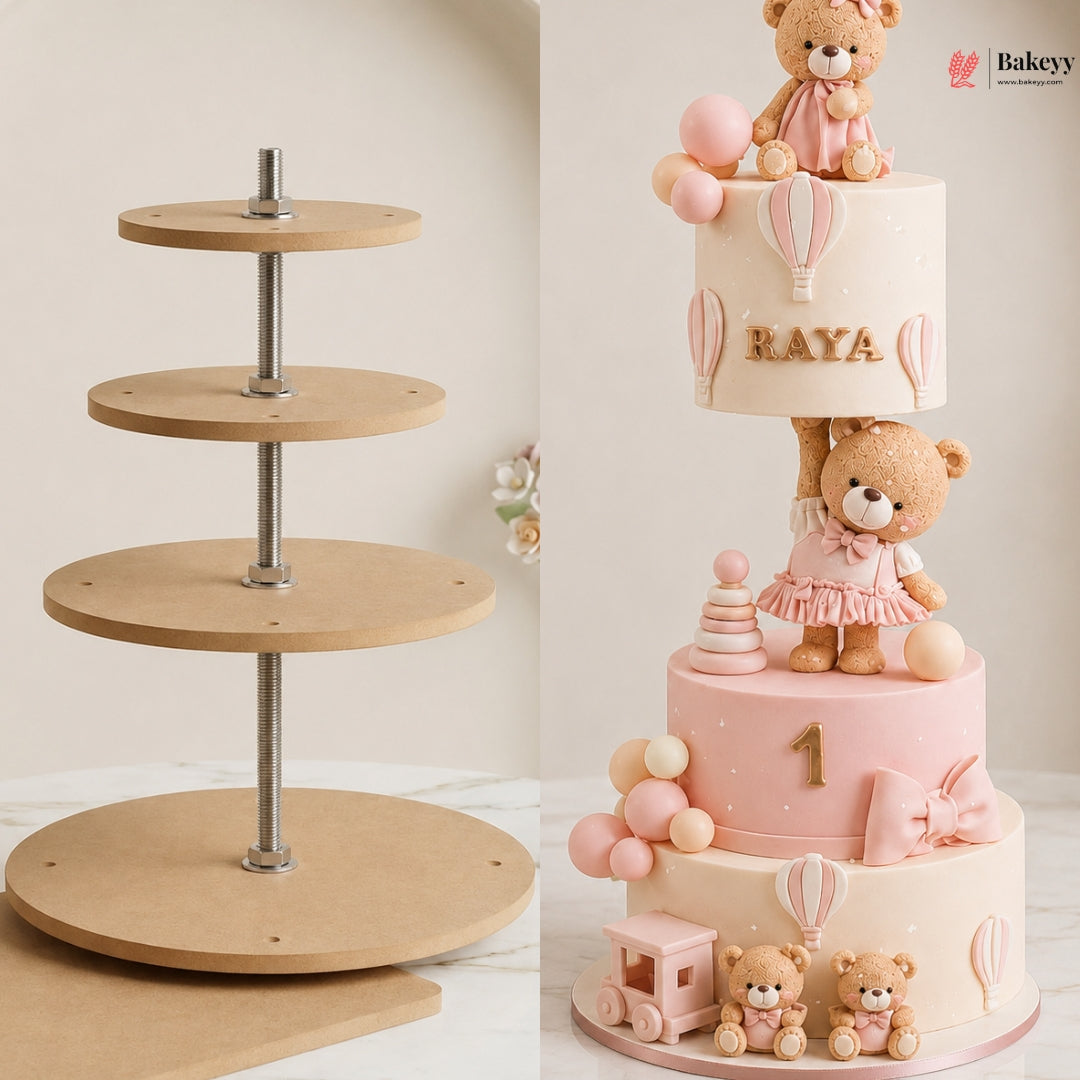 Three-tiered cake with teddy bears and balloons on a wooden cake stand.