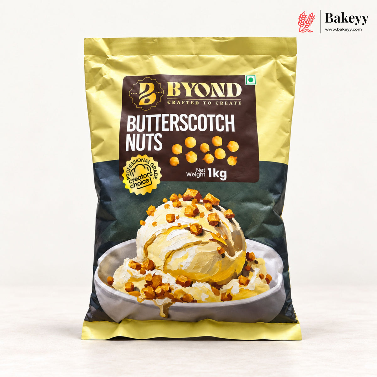 A 1 kg bag of Byond Butterscotch Nuts, featuring a gold and dark green packaging design with a central brown label and an image of an ice cream dessert topped with nuts. The Bakeey brand logo is visible in the top right corner.