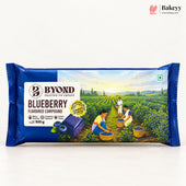 A 500 g package of Byond Blueberry Flavoured Compound Baking Powder, featuring a dark blue wrapper with an illustration of a blueberry field and workers picking blueberries.