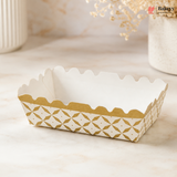 White paper tray with gold geometric pattern on a light surface, featuring the brand 'Bakey'.