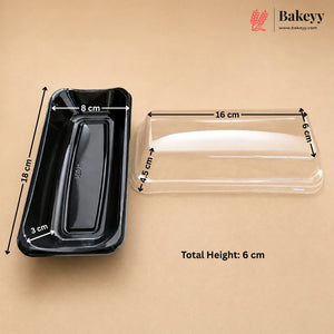 Black rectangular bakery tray with dimension arrows and measurements next to a clear plastic lid, on a beige background. The Bakeyy logo is in the top right corner.