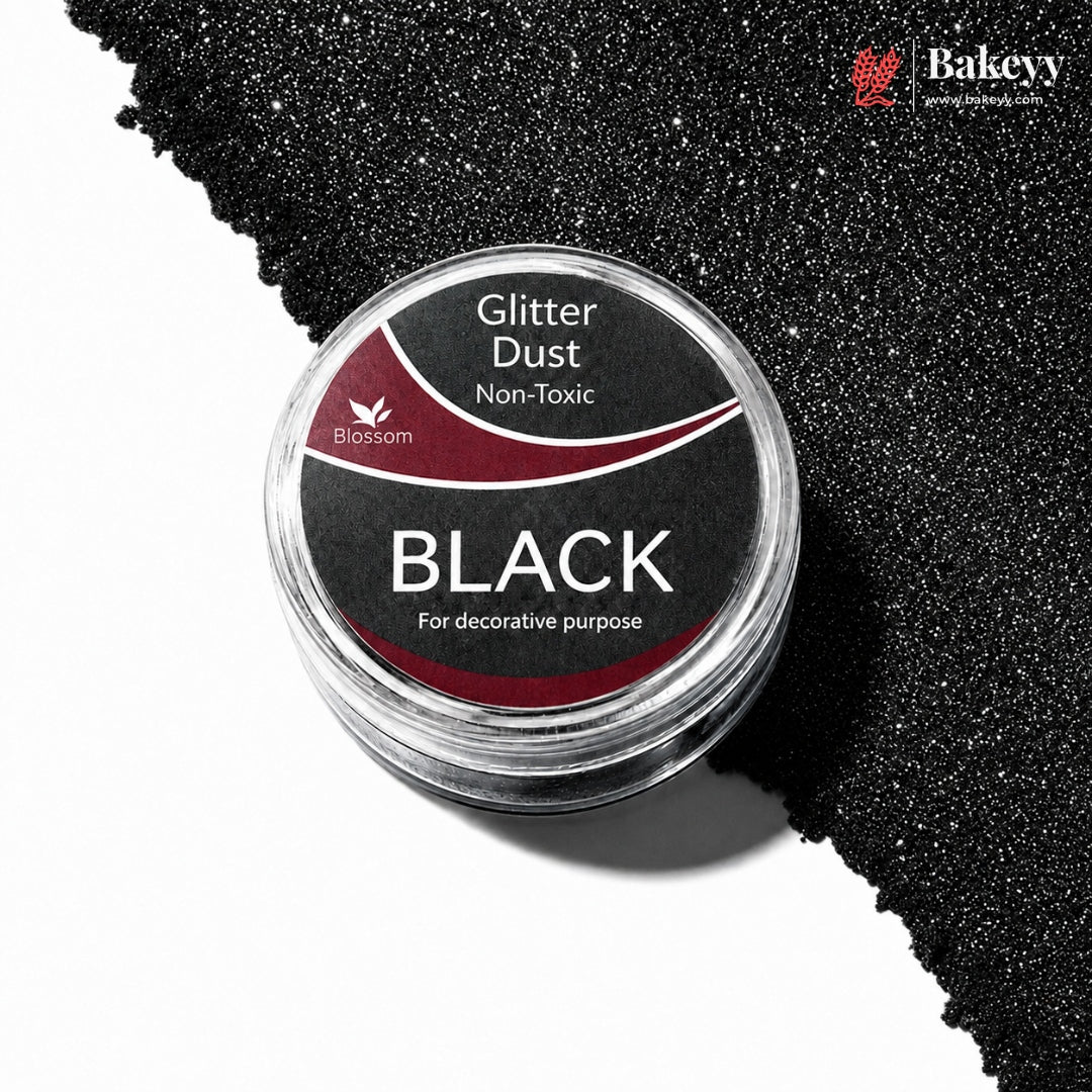 Black glitter dust container with visible glitter on a white background