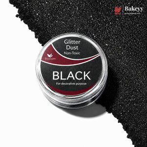 Black glitter dust container with visible glitter on a white background